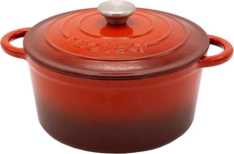 A red-orange enameled cast iron Dutch oven with a matching lid and silver knob, featuring side handles and the 'le creole' brand name embossed on the lid.