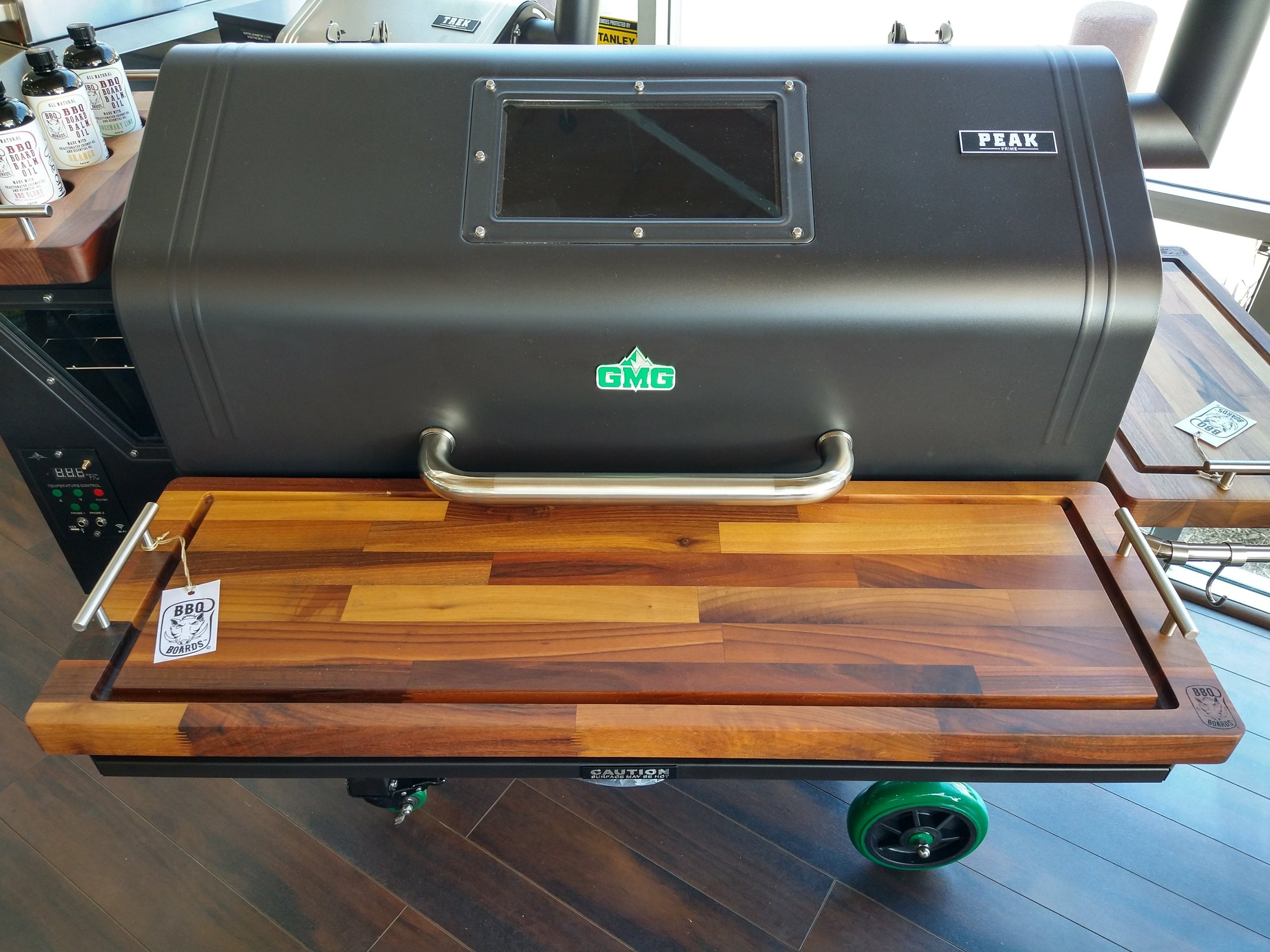 Grill with wooden lid on a wooden floor
